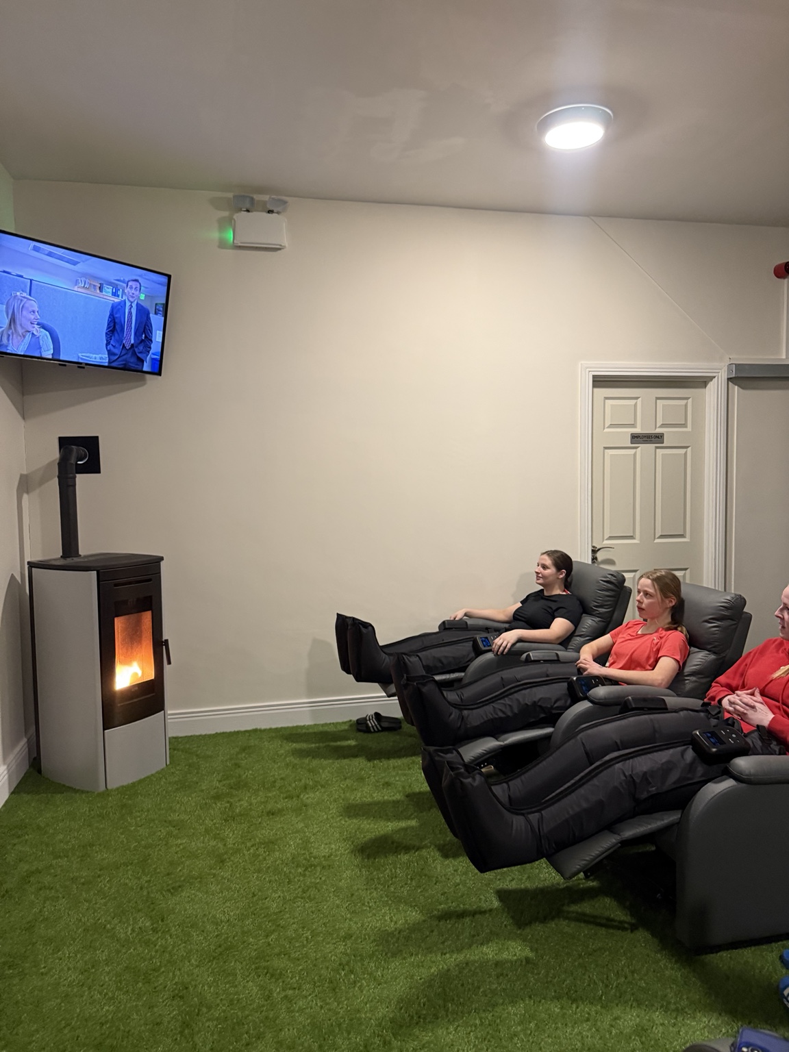 Guests relaxing in compression boots at Revibe